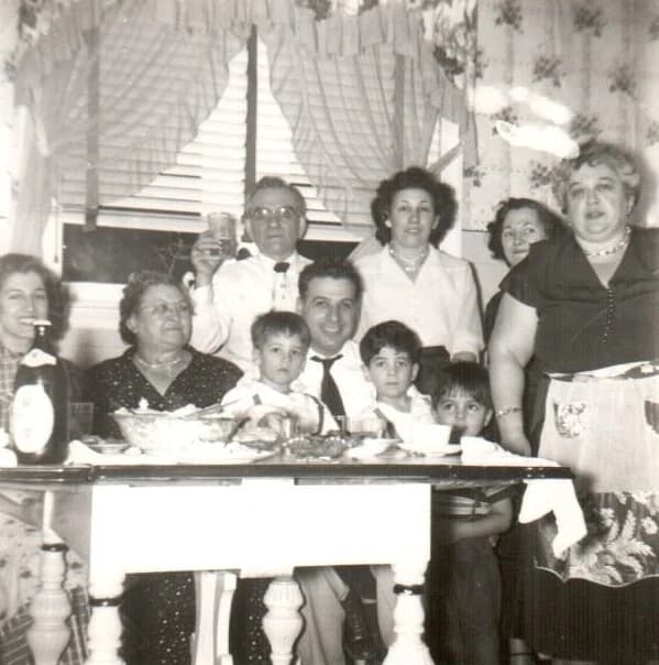 A photograph of the family around a table